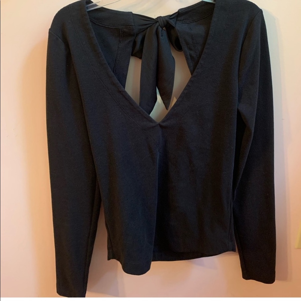 Free people black top with open back and bow detail